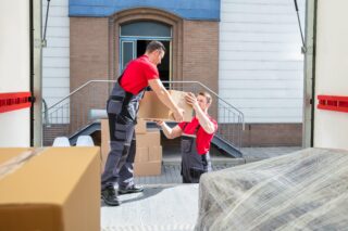 young-movers-unloading-boxes-van-320x213.jpg